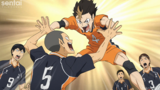 Ryunosuke and Yu celebrate by giving each other high fives.
