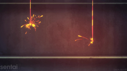 Two senko hanabi, or Japanese sparklers, burn shoot off sparks in front of a concrete staircase.