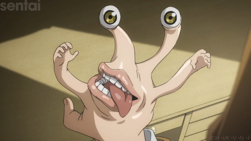 Migi from Parasyte -the maxim- possesses the hand of Shinichi Izumi. The misshapen, seemingly now boneless hand now has tiny mini-hands on the forefinger and pinkie, a mouth (complete with a full set of teeth and a lolling tongue) in the center of the back of the hand, and two eyeballs on the tips of the middle and ring fingers. 