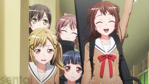 Kasumi from BanG Dream! holds one hand aloft, grinning. Her friends stand behind her, looking more subdued. They all wear the same brown school uniform with a red ribbon on the collar.