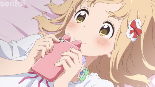 Yui lies back on her bed, clutching her cute pink cell phone and sweetly smiling.