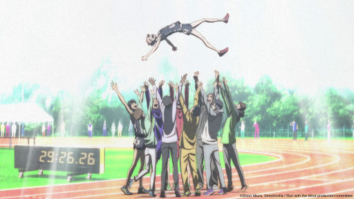 The entire team from Run with the Wind celebrates Prince's accomplishment by throwing him up in the air.